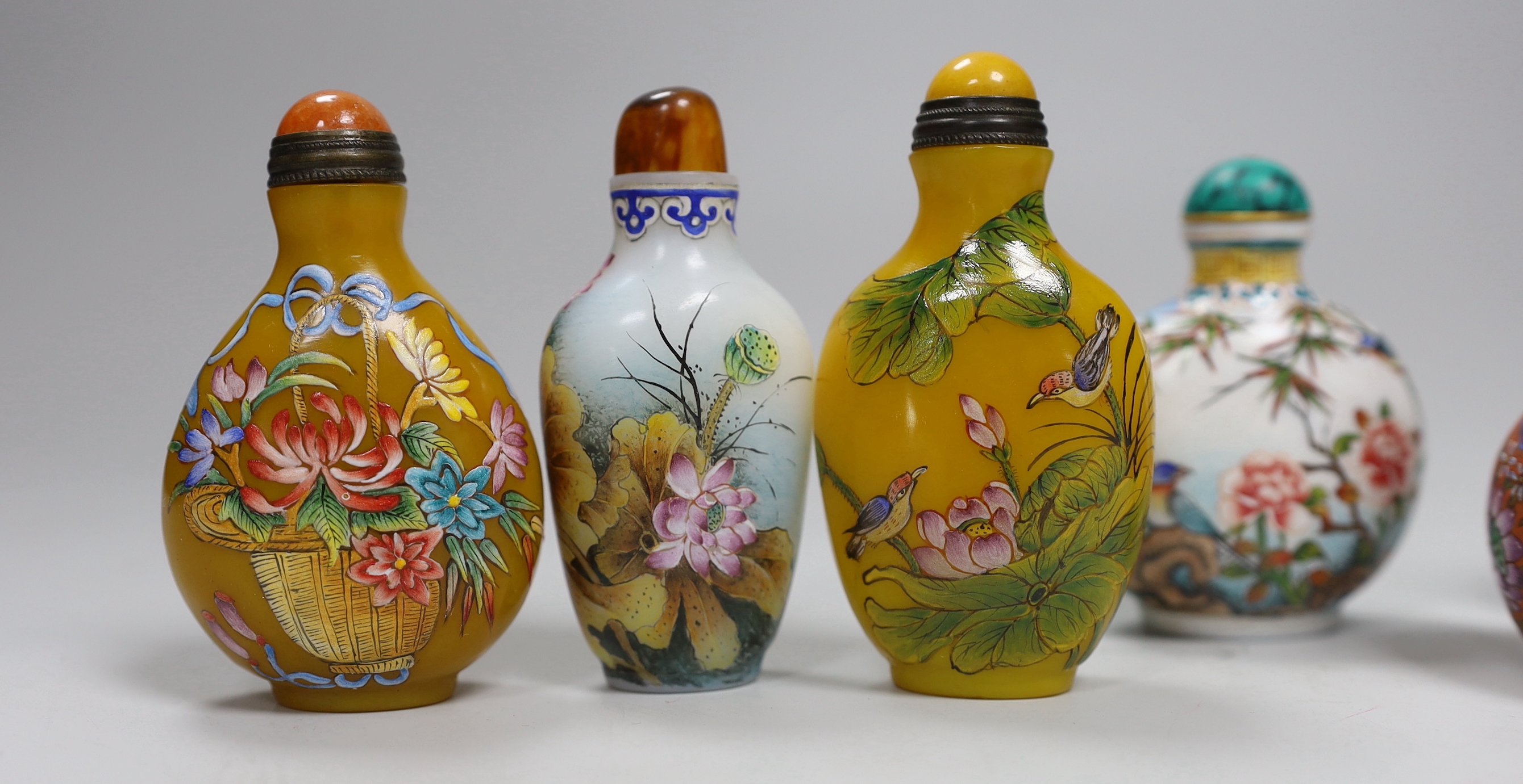 Seven Chinese enamelled glass bottles, tallest 9cm high